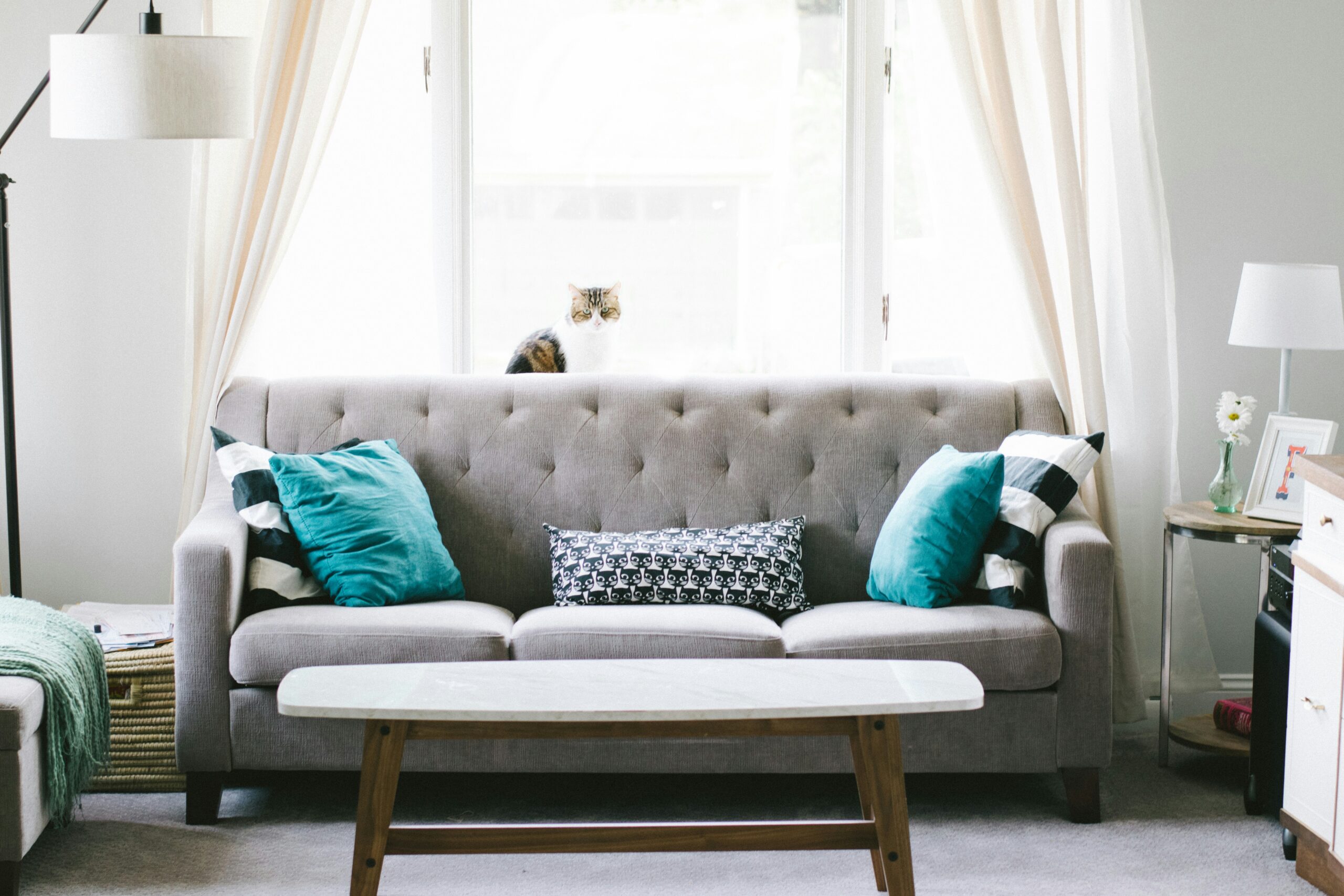 brown-and-white-wooden-table-beside-sofa-chair
